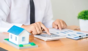 Professional reviewing data and calculations for accurate financial reporting with a focus on real estate analysis.