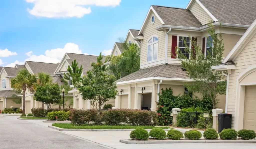A row of well-maintained townhomes in a Southern California HOA neighborhood with landscaping, ideal for property management and board governance.